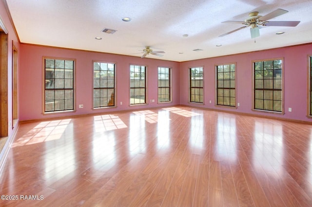 107 W Bayou Shr, Lafayette, LA 70508 - unfurnished room featuring a textured ceiling, light hardwood / wood-style flooring, and ceiling fan