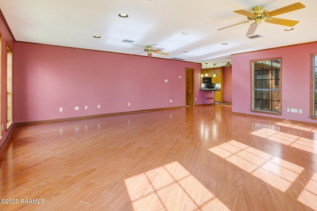 107 W Bayou Shr, Lafayette, LA 70508 - unfurnished living room with ceiling fan, light hardwood / wood-style flooring, and ornamental molding