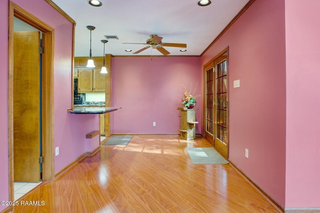 107 W Bayou Shr, Lafayette, LA 70508 - interior space with decorative light fixtures, light hardwood / wood-style flooring, ceiling fan, and ornamental molding