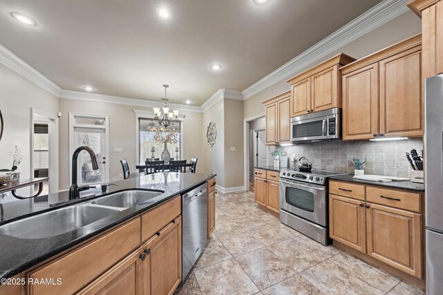 kitchen with decorative light fixtures, stainless steel appliances, a notable chandelier, crown molding, and sink