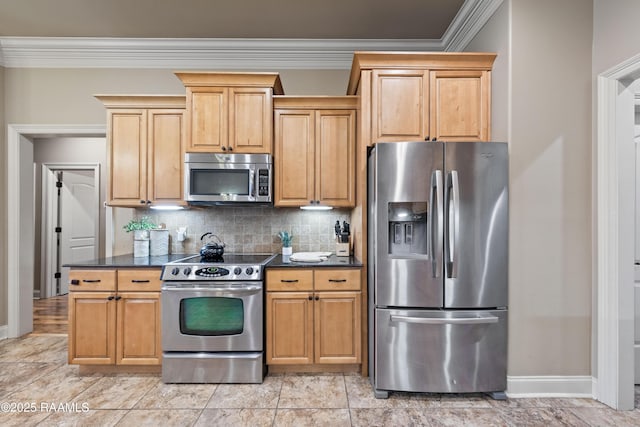 kitchen with appliances with stainless steel finishes, ornamental molding, and decorative backsplash