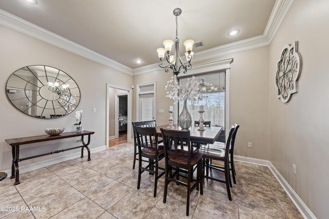 dining space featuring ornamental molding and an inviting chandelier