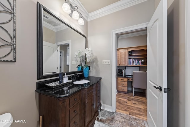 bathroom featuring ornamental molding and vanity