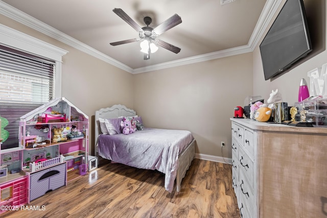 bedroom with hardwood / wood-style flooring, ceiling fan, and ornamental molding