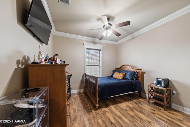 bedroom with ceiling fan, crown molding, and dark hardwood / wood-style floors