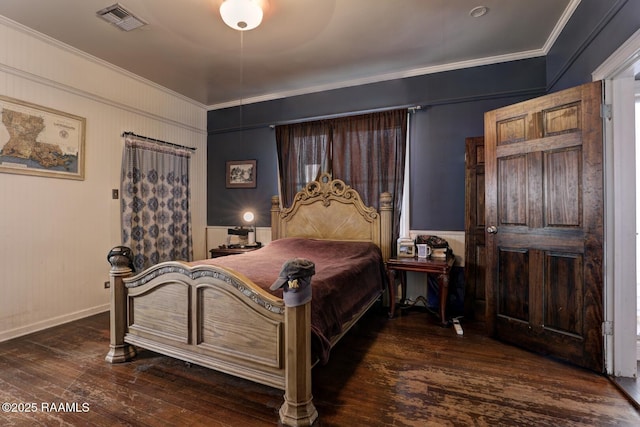 bedroom with dark hardwood / wood-style floors, ceiling fan, and ornamental molding