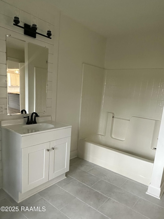 bathroom with tile patterned flooring, vanity, and shower / bathing tub combination