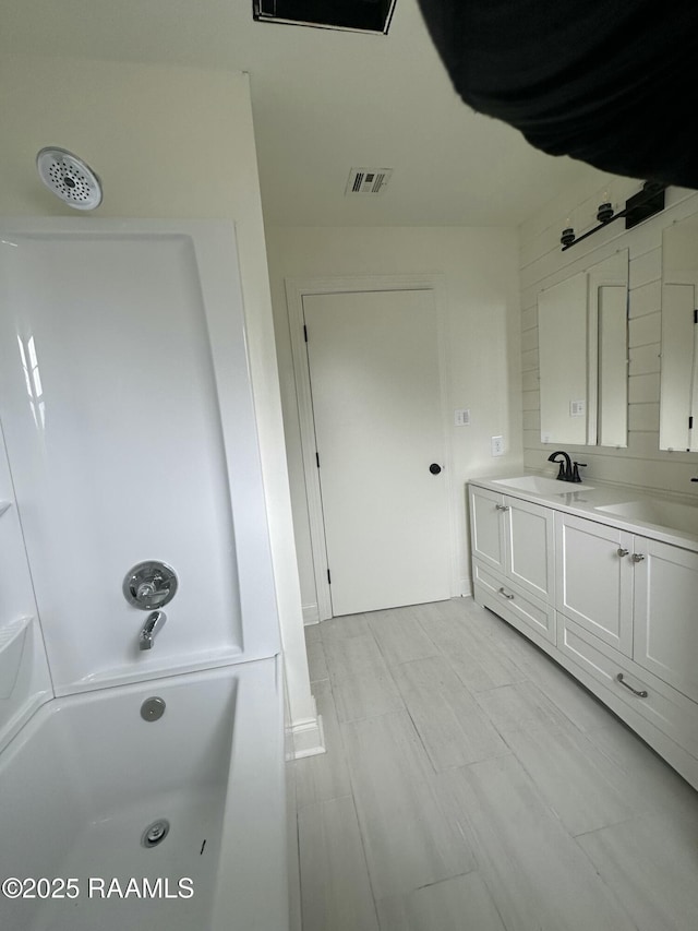 bathroom with shower / tub combination and vanity