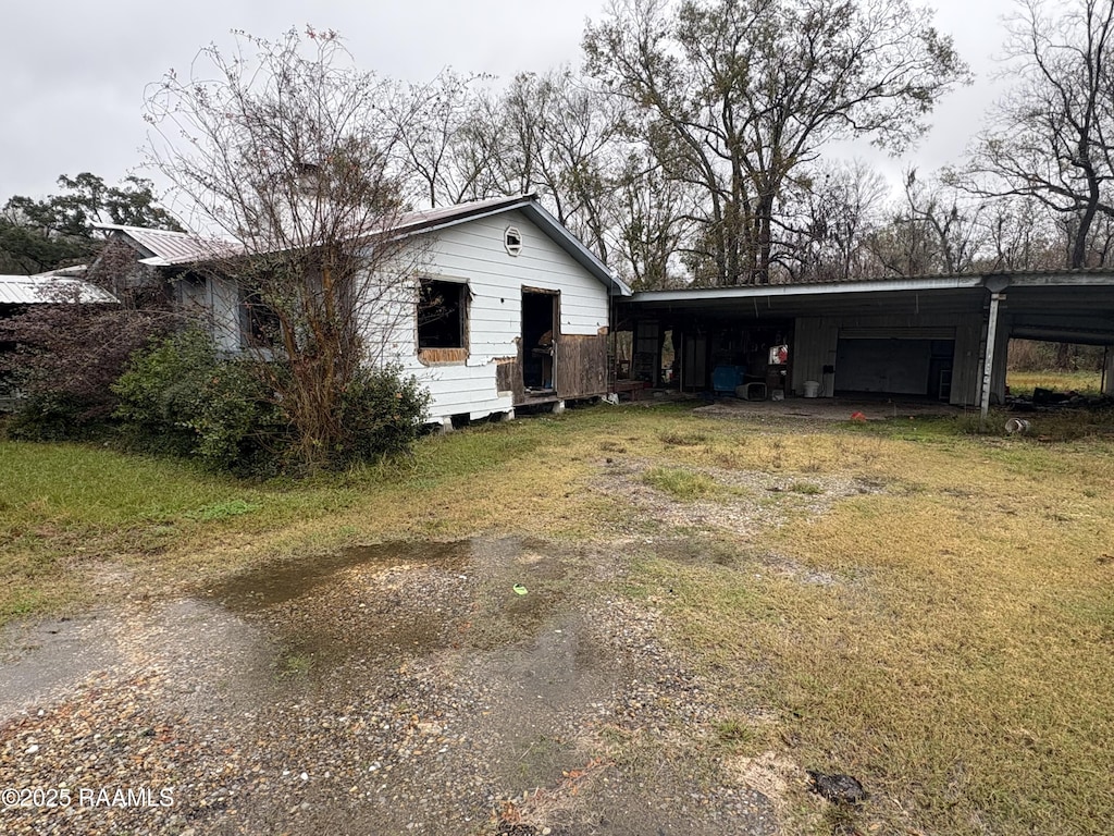 view of front of property with a carport