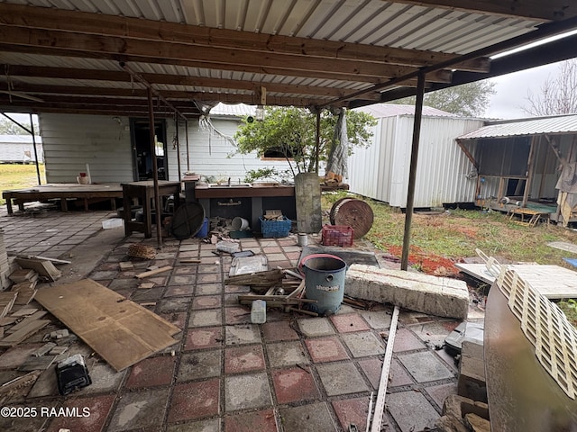 view of patio / terrace with a shed