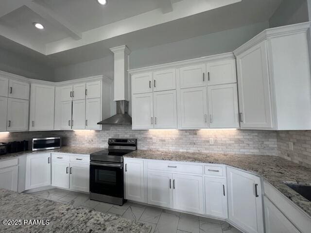 kitchen with decorative backsplash, stainless steel range with electric cooktop, and white cabinetry