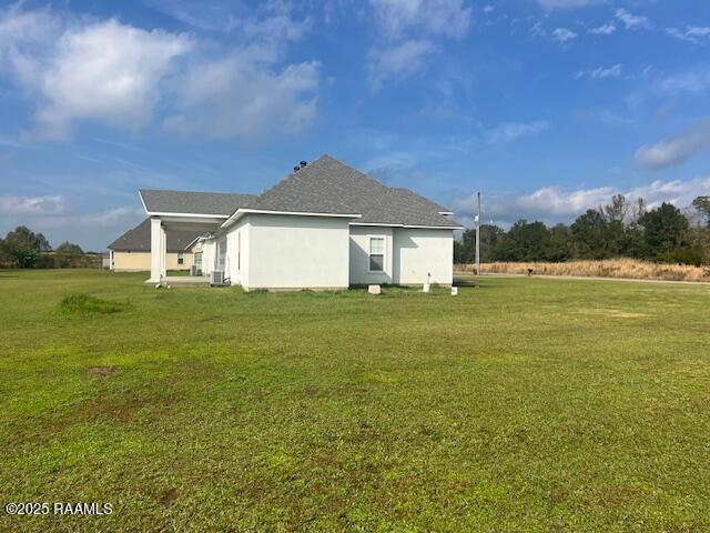 view of home's exterior featuring a lawn