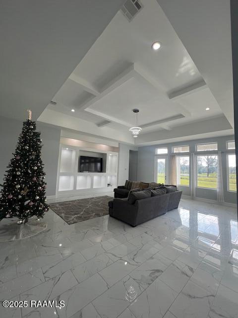 unfurnished living room featuring a raised ceiling