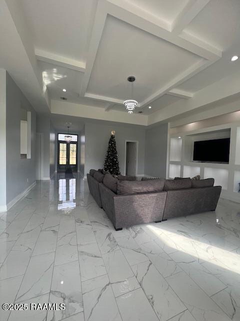 unfurnished living room featuring coffered ceiling, french doors, and beamed ceiling