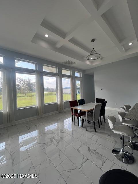 dining area with beam ceiling and coffered ceiling