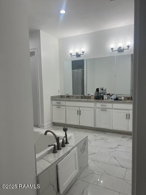 bathroom featuring vanity and plus walk in shower