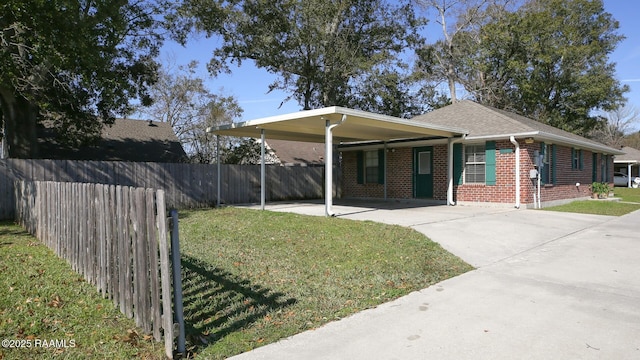 single story home with a front lawn and a carport