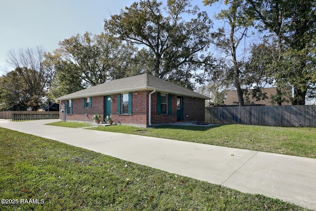 ranch-style house with a front lawn