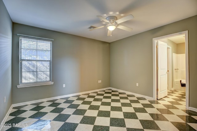 spare room with ceiling fan