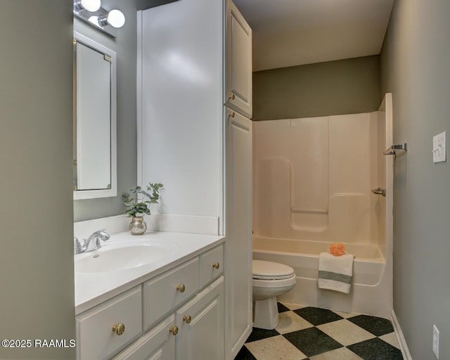 full bathroom featuring toilet, vanity, and washtub / shower combination