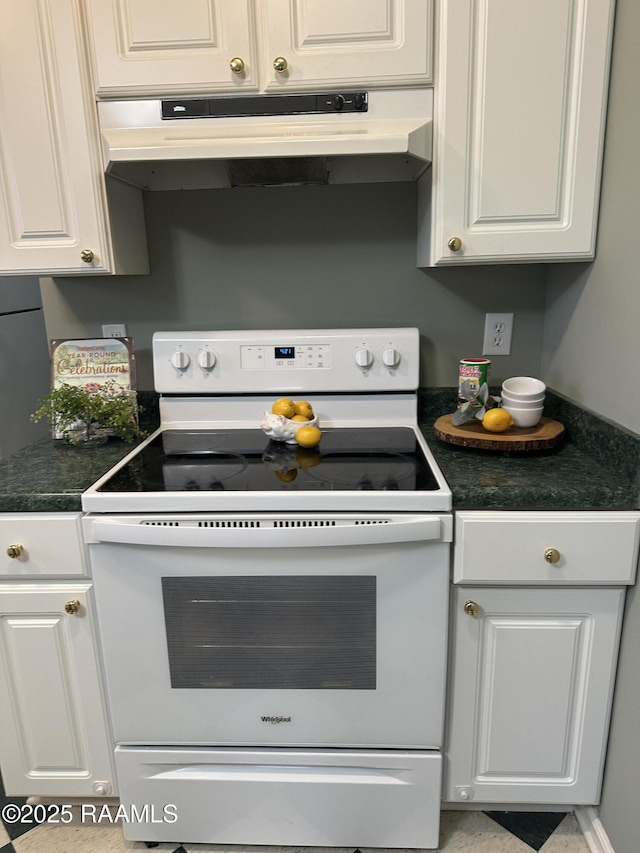 kitchen with white cabinets and white electric stove