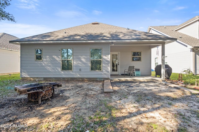 rear view of house with a patio