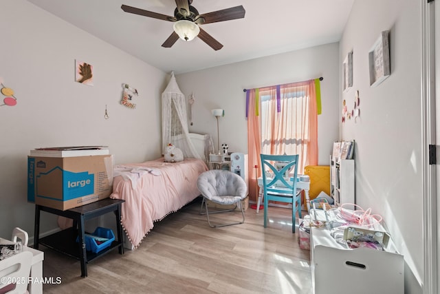 bedroom featuring ceiling fan and light hardwood / wood-style flooring