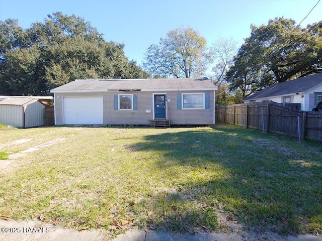 single story home featuring a front yard and a storage unit