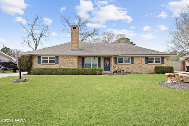 ranch-style house featuring a front lawn