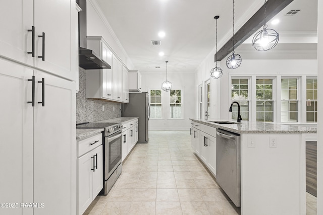 kitchen with white cabinetry, sink, light stone countertops, a kitchen island with sink, and appliances with stainless steel finishes