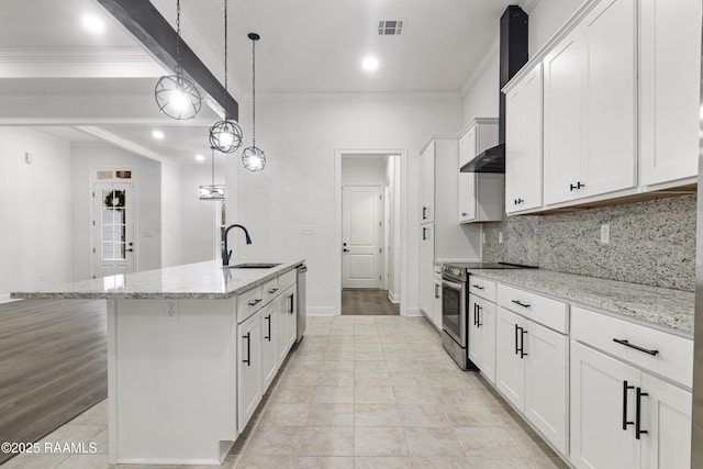 kitchen with a center island with sink, white cabinets, hanging light fixtures, appliances with stainless steel finishes, and light stone counters