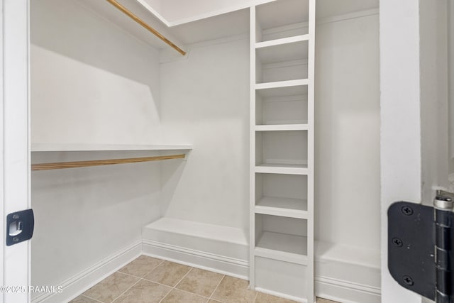 spacious closet featuring tile patterned floors