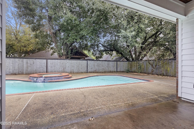 view of pool with an in ground hot tub and a patio