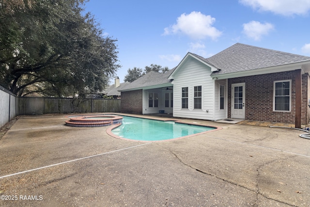 view of pool featuring an in ground hot tub and a patio