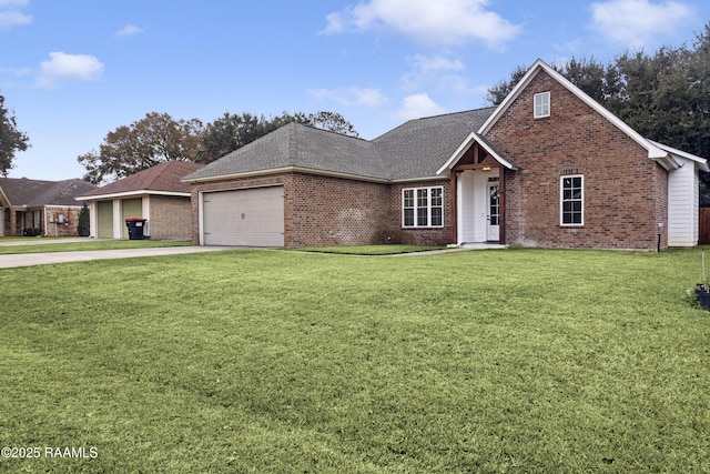 view of front of house featuring a front yard and a garage