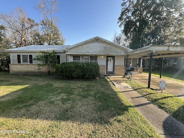 ranch-style house with a carport and a front yard