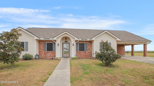 ranch-style home featuring a front yard and a carport