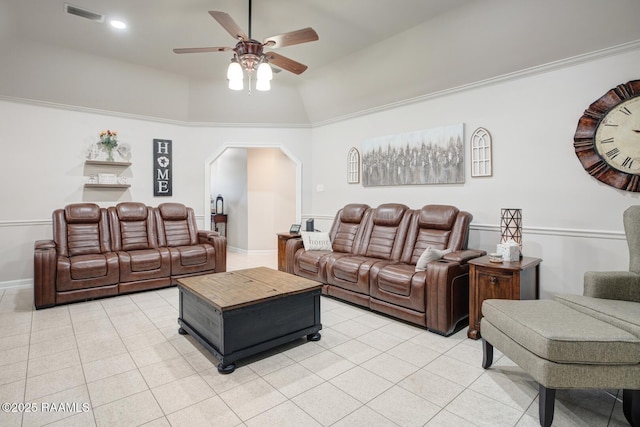 living room featuring ceiling fan, vaulted ceiling, and light tile patterned floors