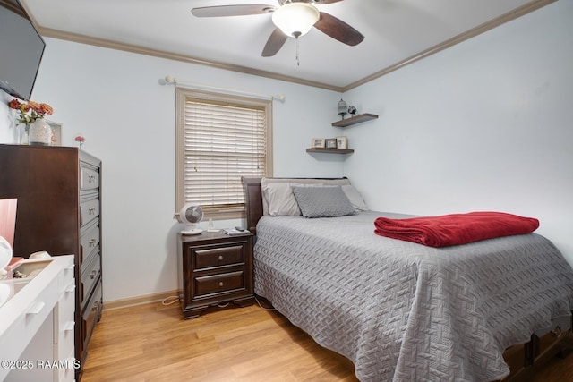 bedroom featuring crown molding, light hardwood / wood-style flooring, and ceiling fan