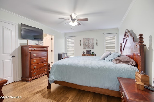 bedroom with ceiling fan, ornamental molding, and light hardwood / wood-style flooring