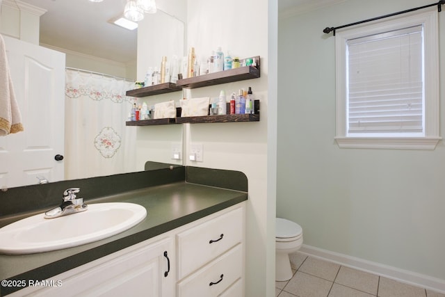 bathroom with crown molding, toilet, tile patterned floors, and vanity