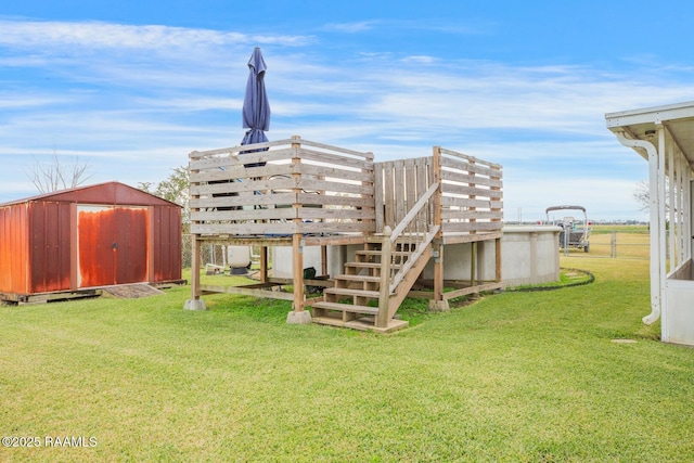 back of property with a lawn and a storage unit