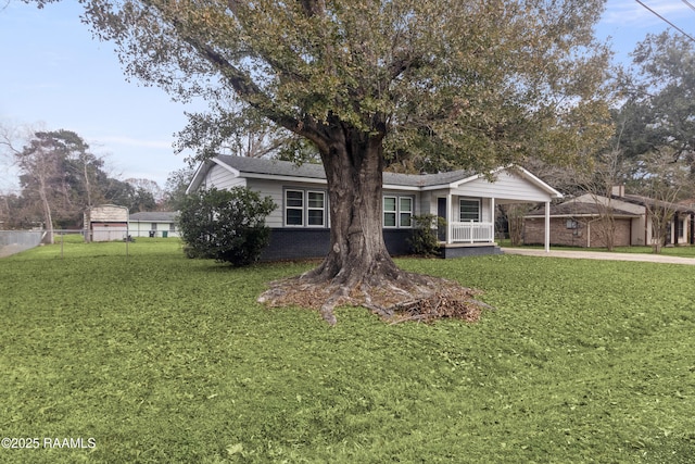 view of front of home with covered porch and a front yard