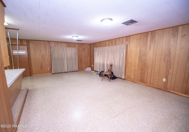 interior space featuring wood walls