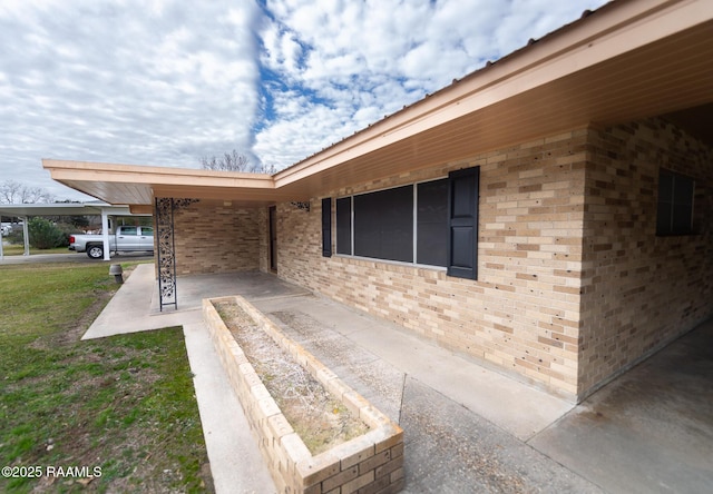 entrance to property with a carport