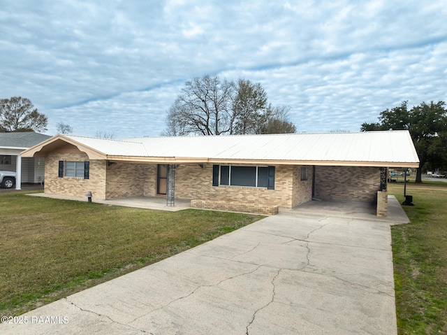 single story home with a front yard and a carport