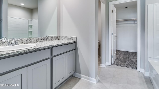 bathroom with vanity and toilet