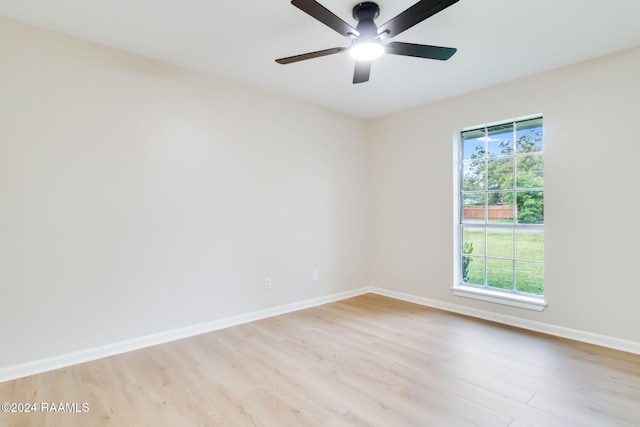 unfurnished room with ceiling fan, plenty of natural light, and light hardwood / wood-style flooring