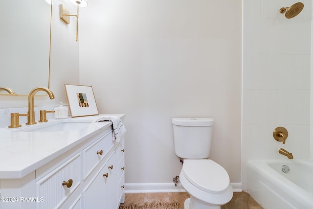 full bathroom featuring tiled shower / bath, vanity, and toilet