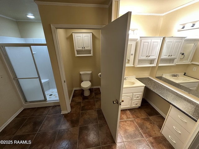 bathroom with vanity, toilet, an enclosed shower, and crown molding